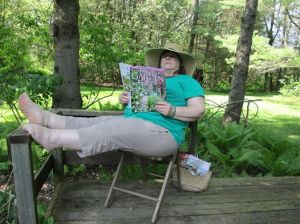 Me on the back deck reading a gardening book